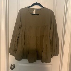 large, green blouse with ruffles
